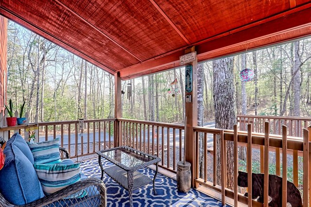 wooden deck featuring a water view