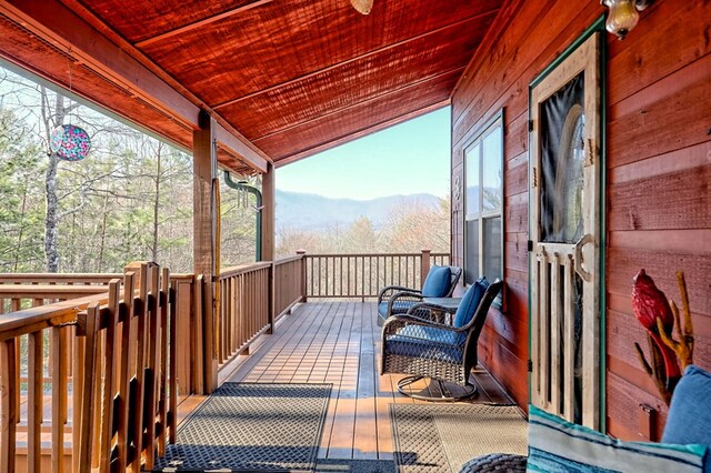 wooden terrace with a mountain view