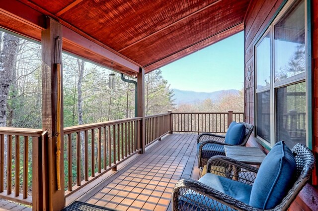 wooden deck with a mountain view