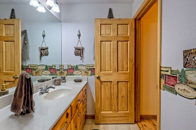 bathroom featuring vanity and wood finished floors