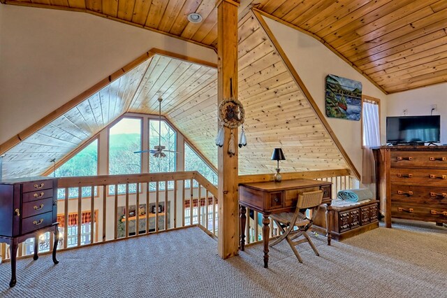 bedroom with wooden ceiling, multiple windows, and carpet