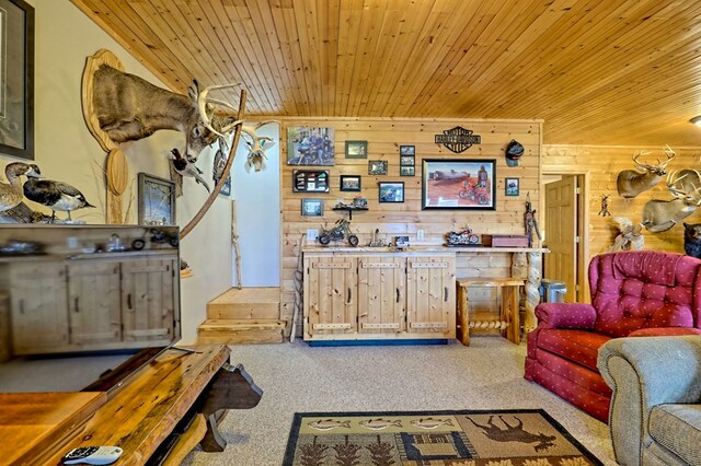 living area featuring wooden walls, wood ceiling, and carpet floors