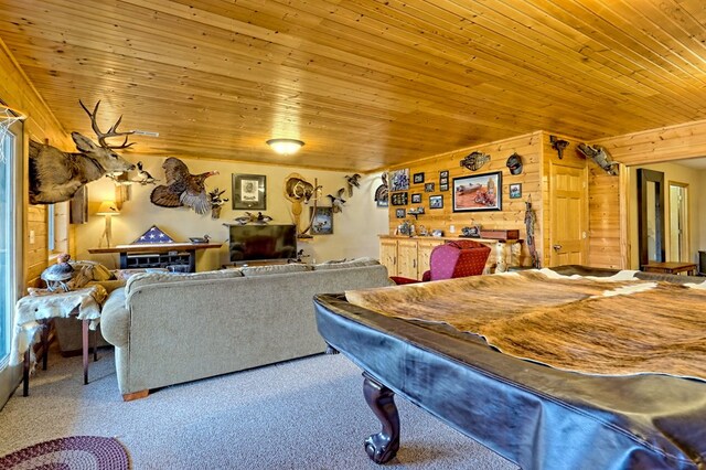 game room featuring carpet floors, wooden ceiling, and wood walls