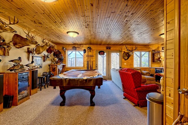 recreation room with plenty of natural light, wooden ceiling, and carpet flooring