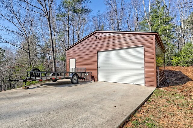 detached garage featuring driveway