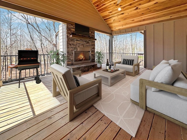 wooden deck featuring an outdoor living space with a fireplace