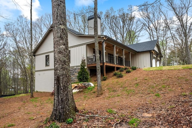 view of side of property with a sunroom