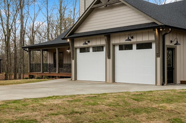 exterior space featuring a garage and a lawn