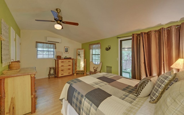 5557 Joe Brown Hwy, Murphy, NC 28906 - bedroom with a wall mounted air conditioner, light wood-style flooring, vaulted ceiling, multiple windows, and a ceiling fan