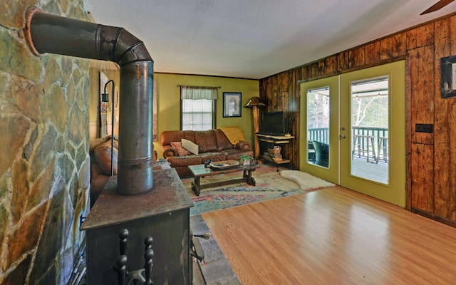 5557 Joe Brown Hwy, Murphy, NC 28906 - living area featuring french doors, wood finished floors, healthy amount of natural light, wooden walls, and a textured ceiling