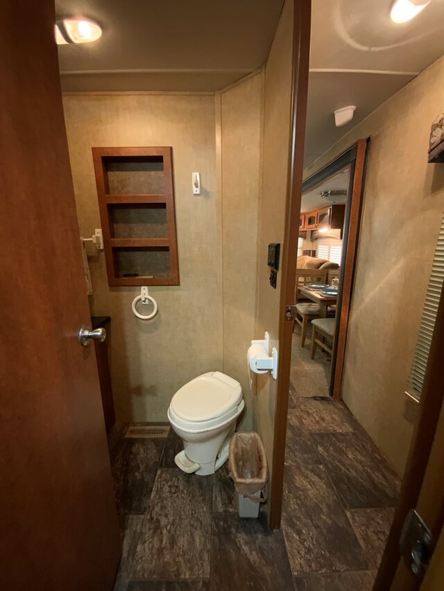 bathroom with tile patterned flooring and toilet