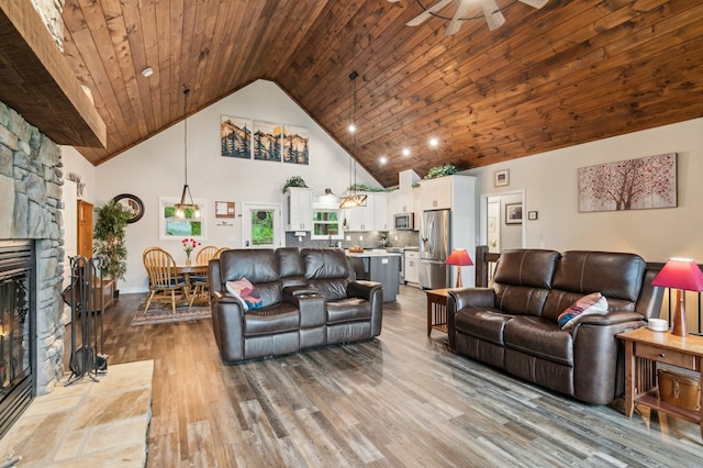 774 Hickory Ridge Dr, Ellijay, GA 30540 - living room with high vaulted ceiling, ceiling fan, dark wood-type flooring, and a fireplace