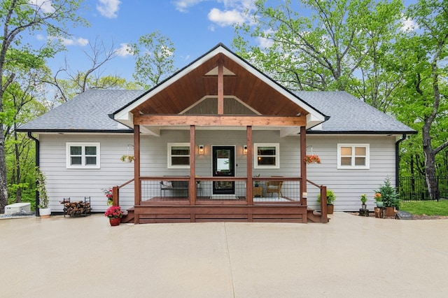 774 Hickory Ridge Dr, Ellijay, GA 30540 - rear view of house featuring roof with shingles, fence, and covered porch