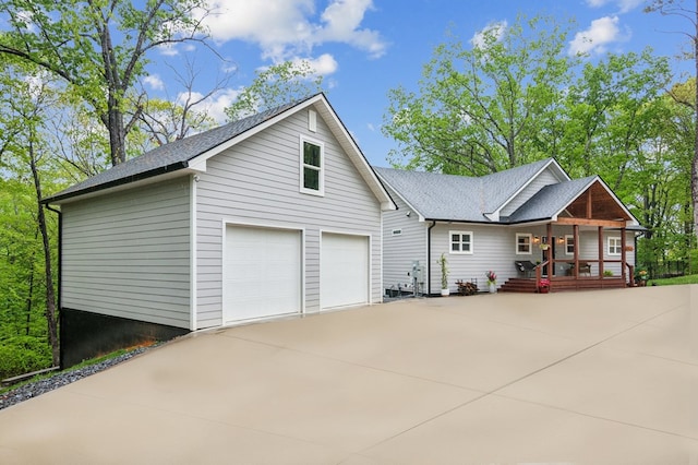 774 Hickory Ridge Dr, Ellijay, GA 30540 - exterior space featuring a porch, driveway, roof with shingles, and a garage