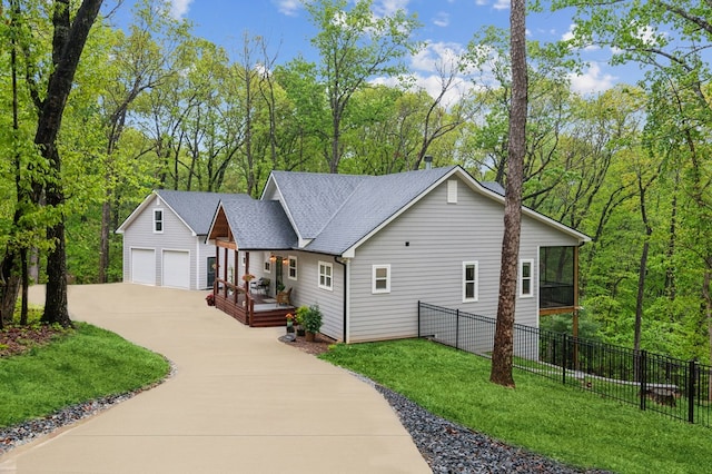 774 Hickory Ridge Dr, Ellijay, GA 30540 - view of front of property featuring fence, a sunroom, concrete driveway, and a front lawn