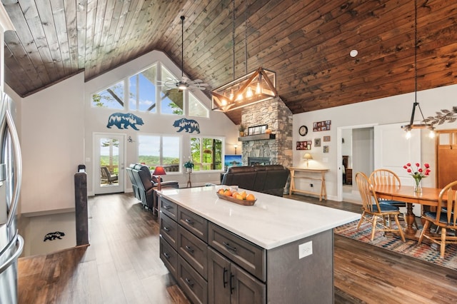 774 Hickory Ridge Dr, Ellijay, GA 30540 - kitchen featuring high vaulted ceiling, a stone fireplace, a ceiling fan, open floor plan, and dark wood-type flooring