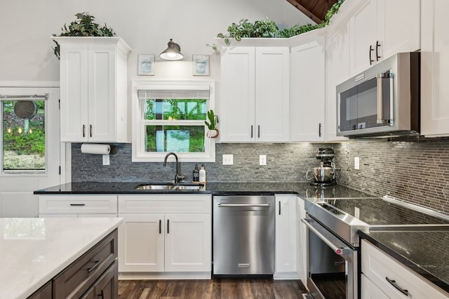 774 Hickory Ridge Dr, Ellijay, GA 30540 - kitchen with backsplash, stainless steel appliances, white cabinets, and a sink
