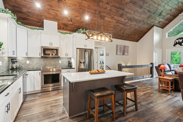 774 Hickory Ridge Dr, Ellijay, GA 30540 - kitchen with dark wood-style floors, high vaulted ceiling, wood ceiling, appliances with stainless steel finishes, and backsplash
