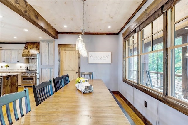 dining space with light wood-style flooring, recessed lighting, baseboards, ornamental molding, and beamed ceiling