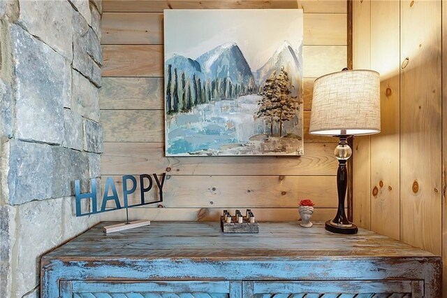 bathroom featuring wood walls