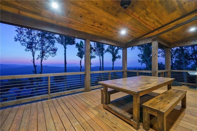 dock area featuring outdoor dining space and a deck with water view