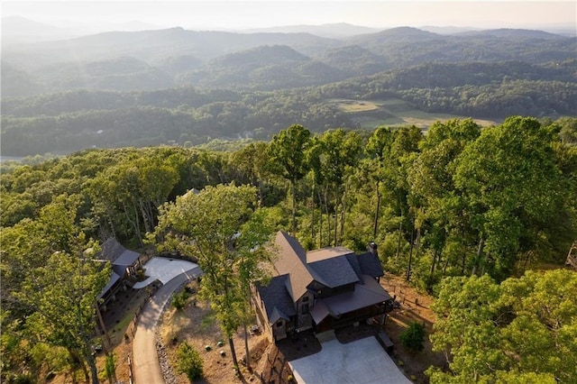 bird's eye view featuring a mountain view and a view of trees