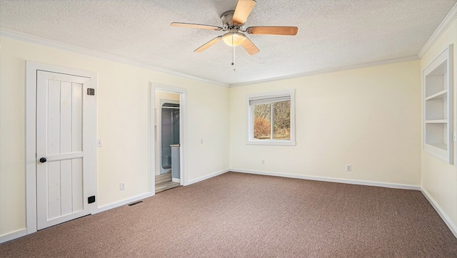 unfurnished bedroom featuring carpet floors, a textured ceiling, and crown molding