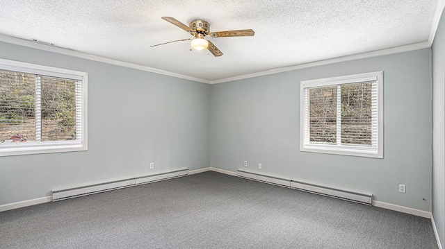 spare room with carpet floors, a baseboard radiator, a ceiling fan, and crown molding