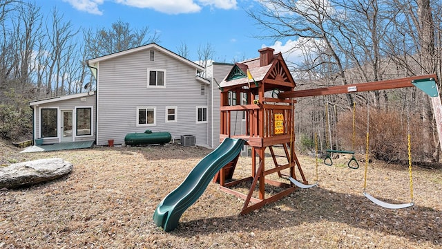 view of playground featuring cooling unit and heating fuel