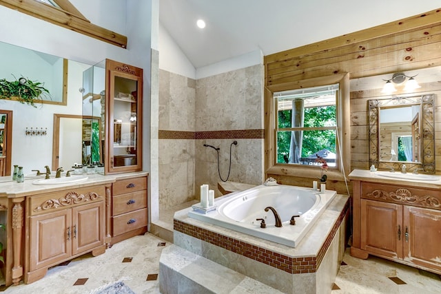 bathroom featuring vanity, separate shower and tub, and lofted ceiling