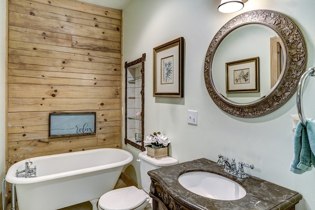 bathroom with vanity, toilet, and a bath