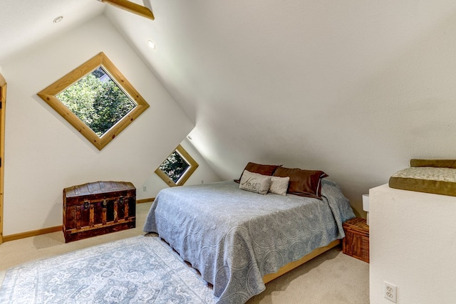 bedroom with light carpet and lofted ceiling