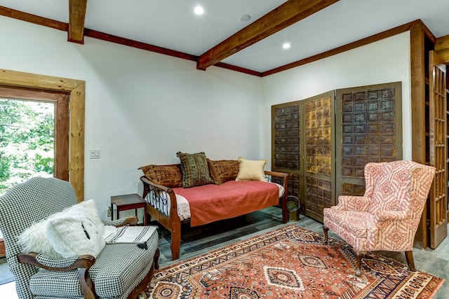 living area featuring beam ceiling