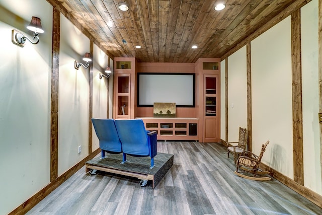 home theater featuring wood ceiling and wood-type flooring