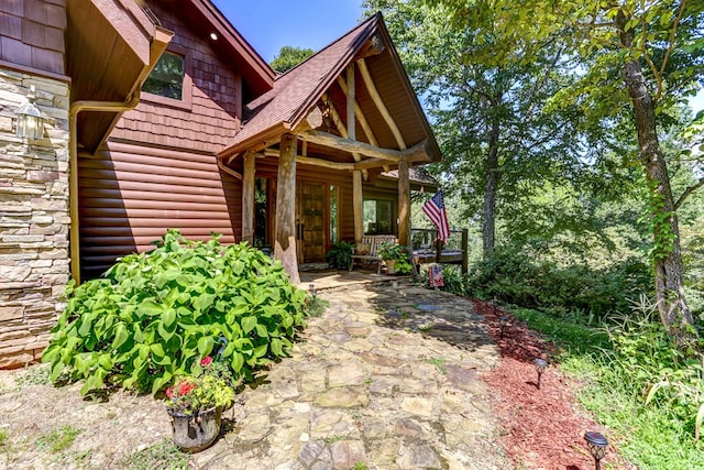 doorway to property with covered porch