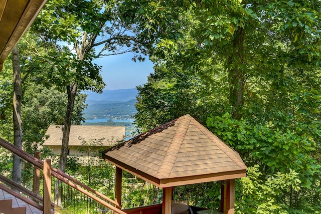 exterior space with a gazebo and a mountain view