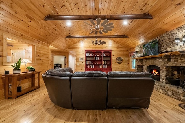 living room featuring ceiling fan, lofted ceiling with beams, light hardwood / wood-style flooring, wooden ceiling, and wood walls