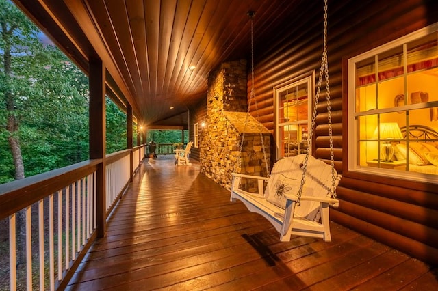 wooden terrace with a porch