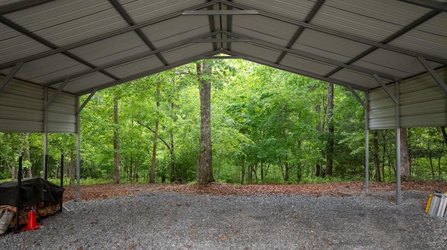 view of parking / parking lot featuring a carport