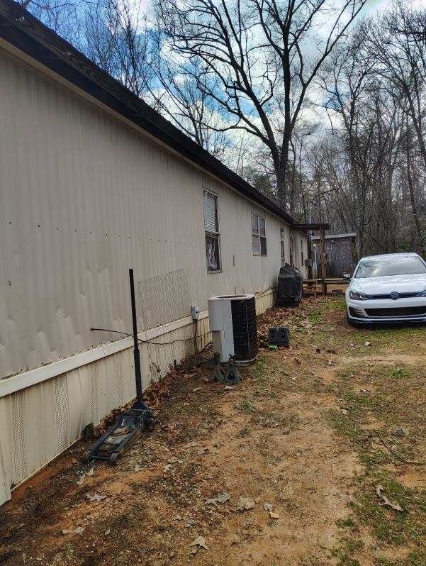 view of property exterior featuring central AC unit