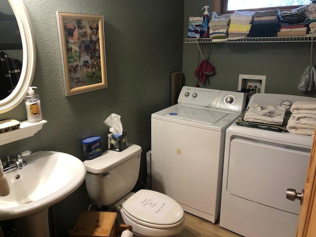 147 Blair Oaks Dr, Blairsville, GA 30512 - washroom with independent washer and dryer, a textured wall, and light wood finished floors