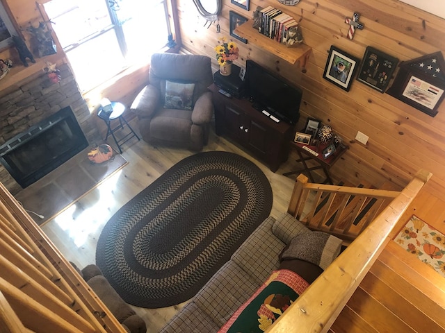147 Blair Oaks Dr, Blairsville, GA 30512 - living area with wood finished floors, wooden walls, and a stone fireplace