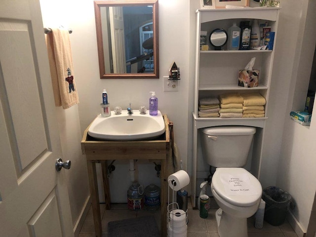 147 Blair Oaks Dr, Blairsville, GA 30512 - half bathroom with a sink, toilet, tile patterned flooring, and baseboards