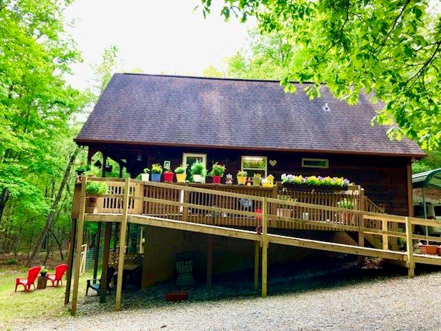 147 Blair Oaks Dr, Blairsville, GA 30512 - rear view of house with a wooden deck and roof with shingles