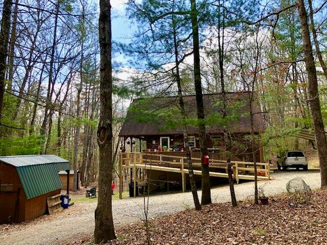 147 Blair Oaks Dr, Blairsville, GA 30512 - back of property with a wooden deck and metal roof