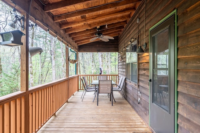 wooden terrace featuring outdoor dining area