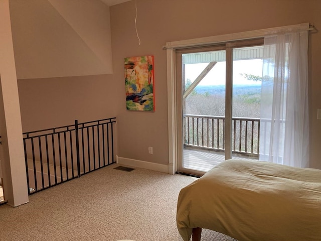 bedroom featuring light colored carpet and access to outside