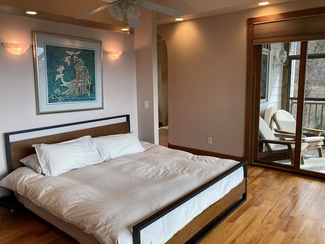 bedroom with access to outside, ceiling fan, and light wood-type flooring