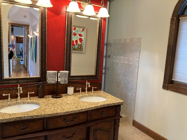 bathroom featuring dual sinks, tile flooring, and large vanity