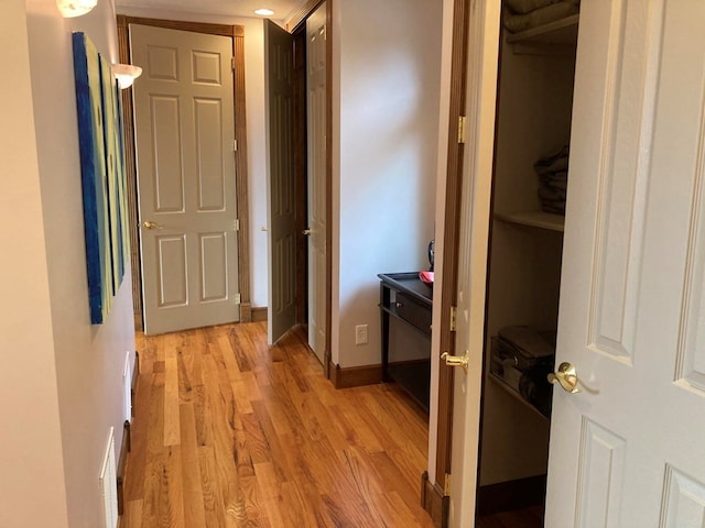 hallway featuring light hardwood / wood-style flooring